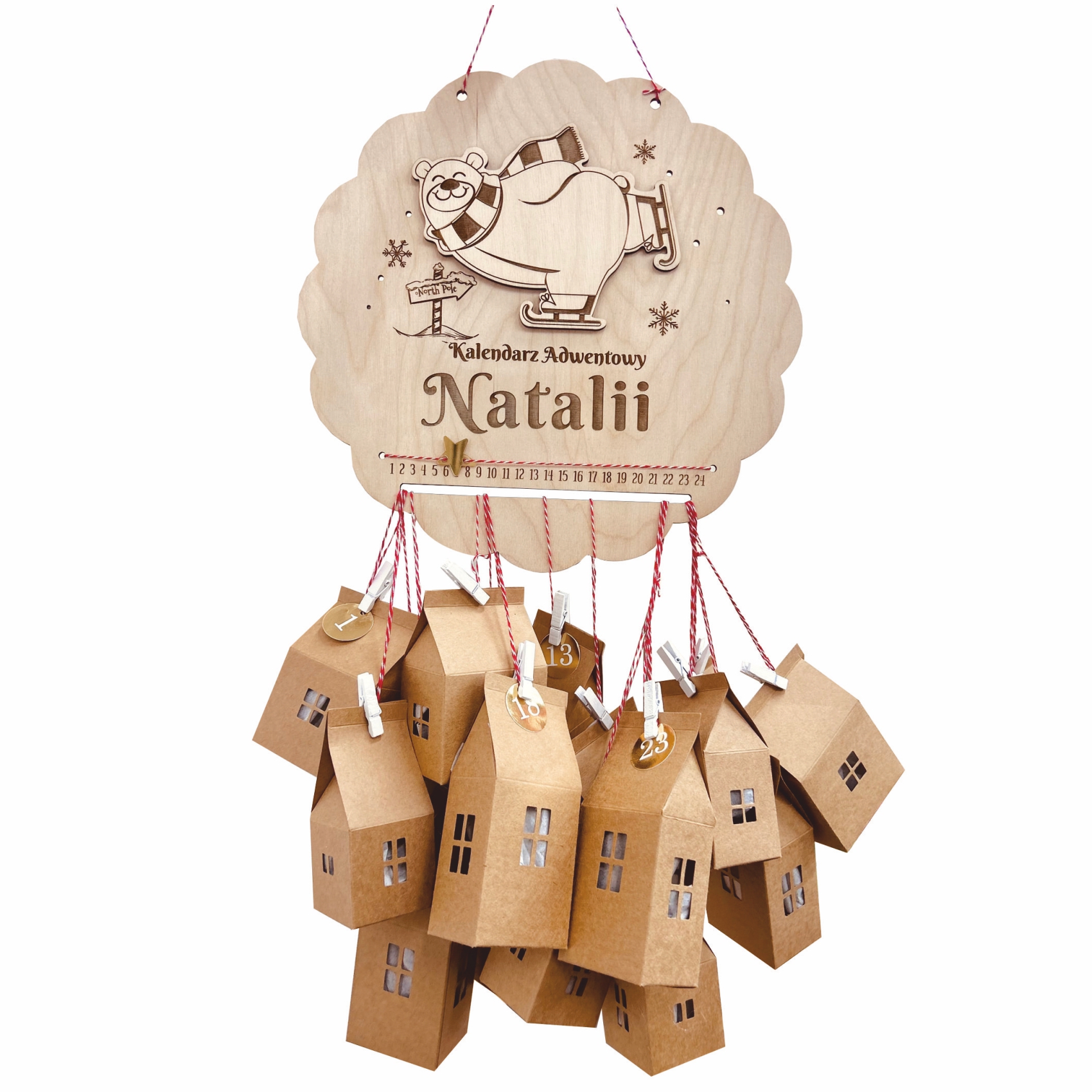 Kalendarz adwentowy w kształcie koła z misiem na łyżwach i domkami na sznurkach